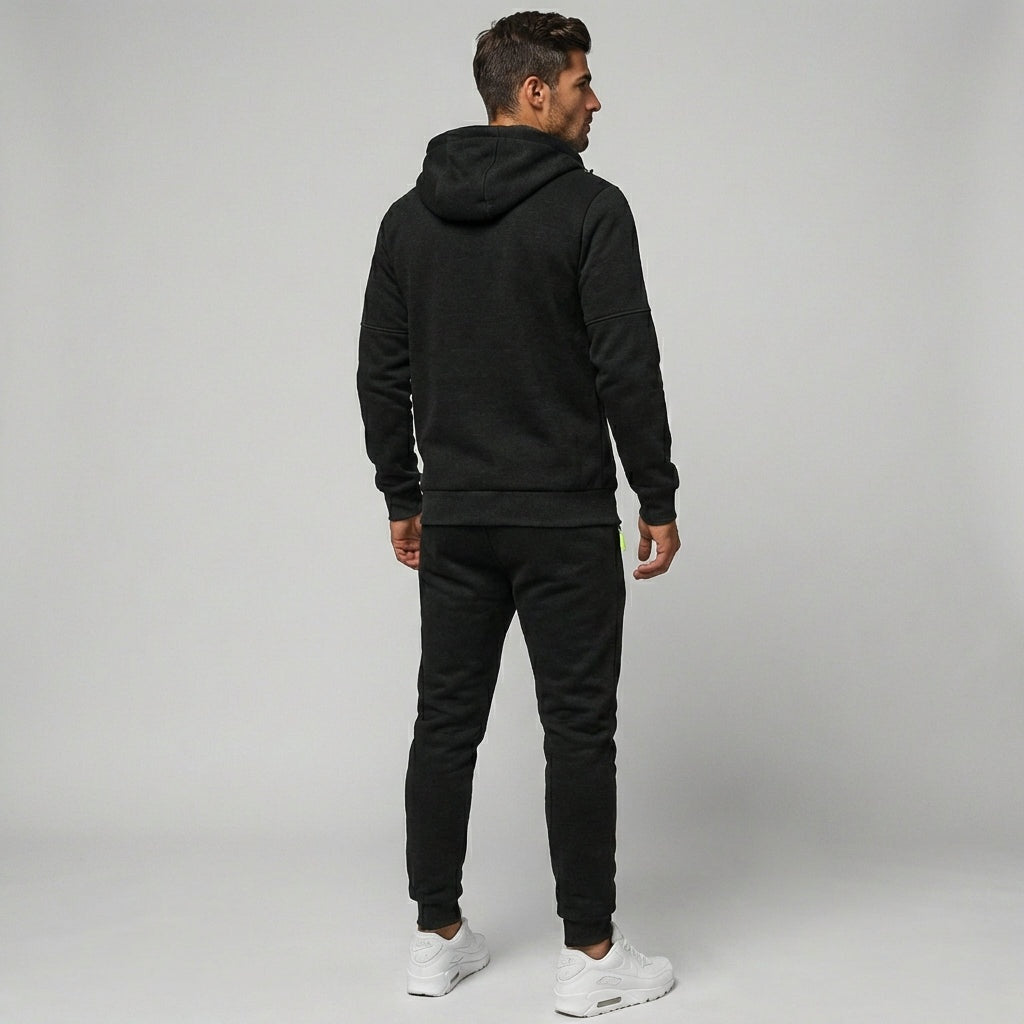 Man wearing black zip hoodie and matching joggers, rear view | Chaps London