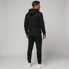 Man wearing black zip hoodie and matching joggers, rear view | Chaps London
