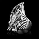 Silver-toned ring featuring grim reaper skeleton design, shown flat on black background | Chaps London