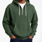 Man wearing olive green ribbed half-zip hoodie with white drawcords | Chaps London