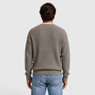 Man wearing grey ribbed knit sweater with jeans, back view shown | Chaps London