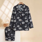 Black pyjama set with pumpkin and moon print on hanger | Chaps London