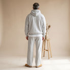 Man wearing light grey hooded tracksuit with straight leg joggers, rear view | Chaps London