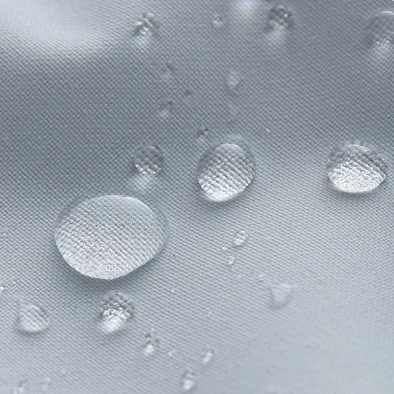 Close-up of water droplets beading on grey waterproof jacket fabric surface | Chaps London