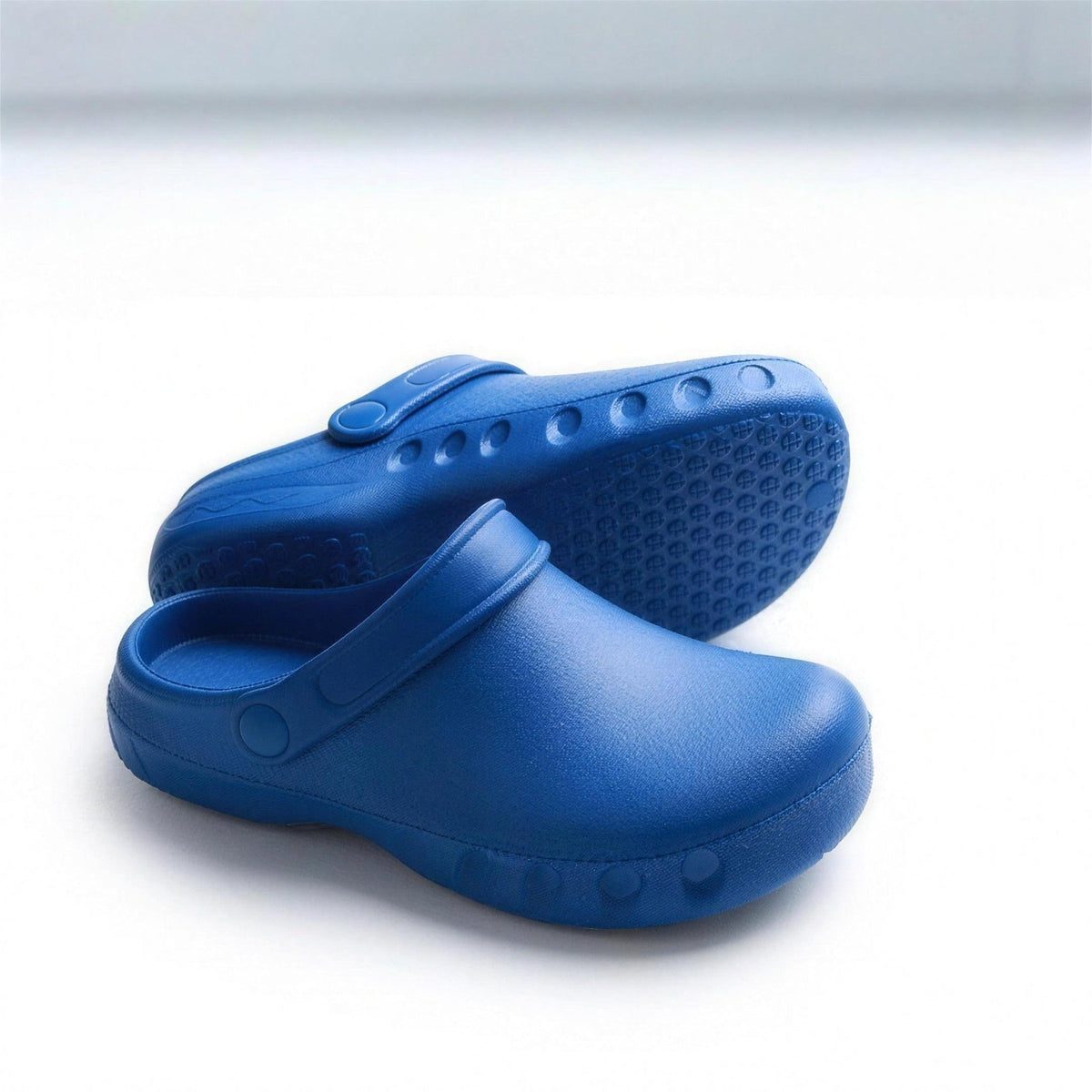 Blue EVA clog pair with heel strap, showing textured non-slip sole | Chaps London