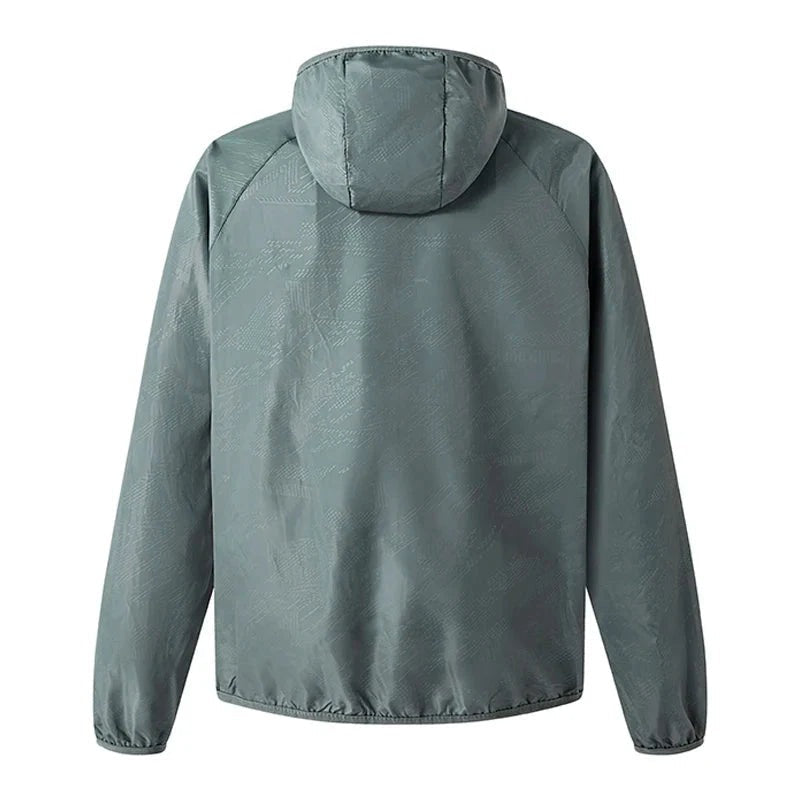 Gray hooded windbreaker jacket, back view, worn by person, textured fabric | Chaps London