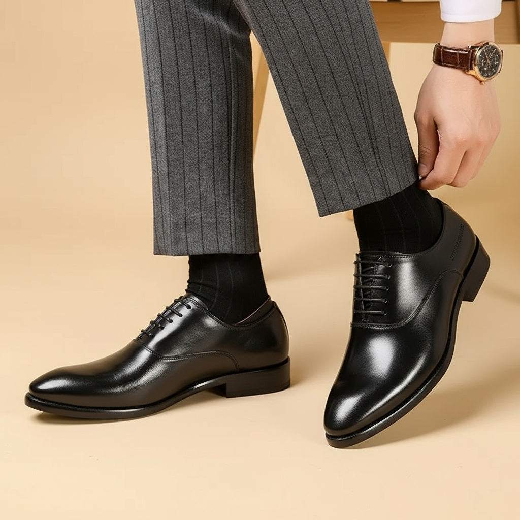 Black lace-up Oxford dress shoes worn with striped trousers and dark socks | Chaps London