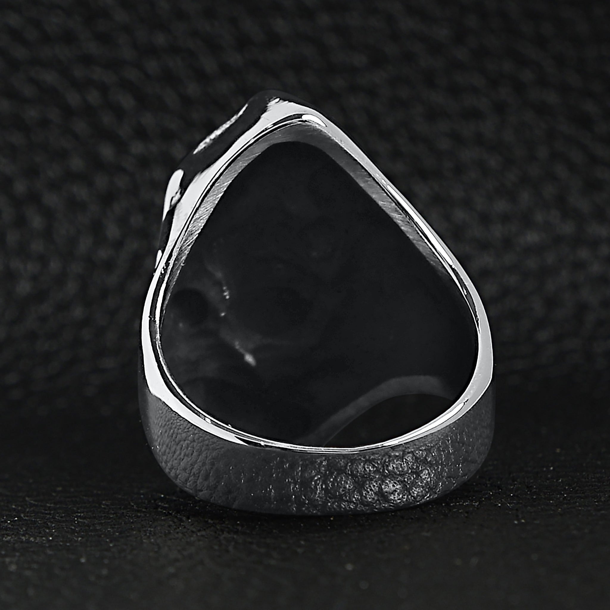 Silver ring back view showing hollow teardrop shape, shown flat on surface | Chaps London