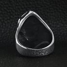 Silver ring back view showing hollow teardrop shape, shown flat on surface | Chaps London