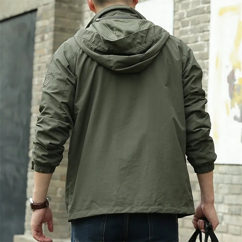Man wearing olive green hooded jacket, back view, outdoors | Chaps London