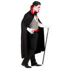 Man wearing black cape, grey waistcoat and red cummerbund, vampire costume | Chaps London