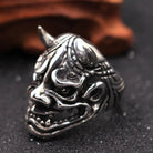 Silver-toned Oni demon mask ring with horns, displayed flat | Chaps London