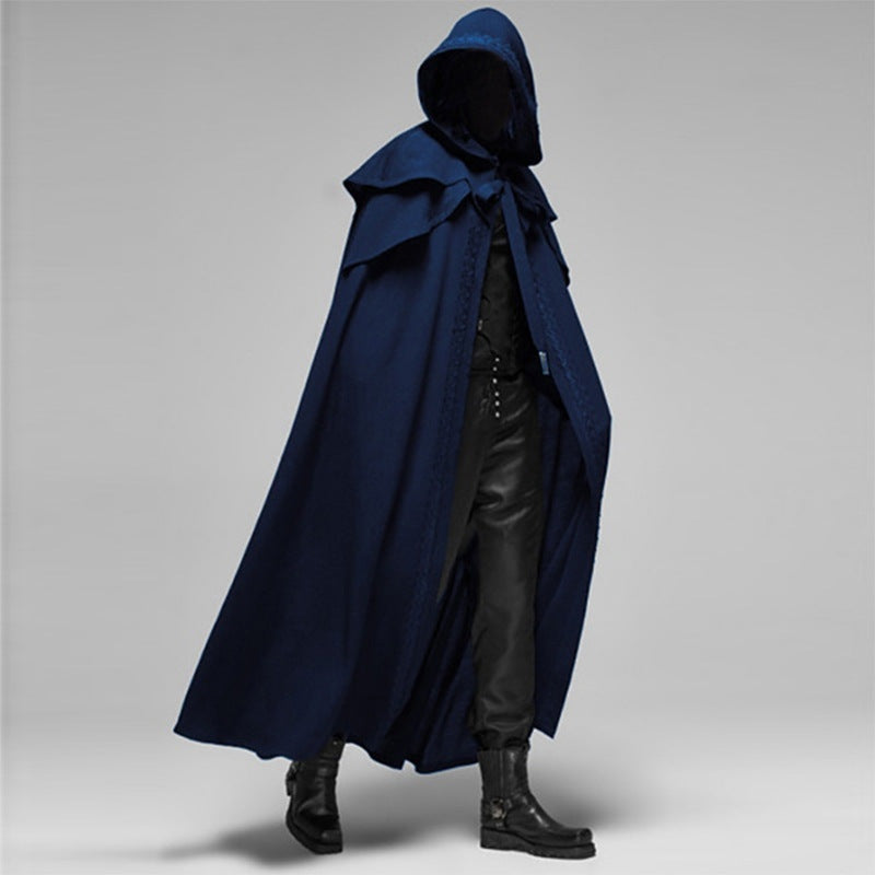 Man wearing navy blue hooded cape with black pants and boots | Chaps London