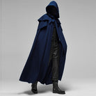 Man wearing navy blue hooded cape with black pants and boots | Chaps London