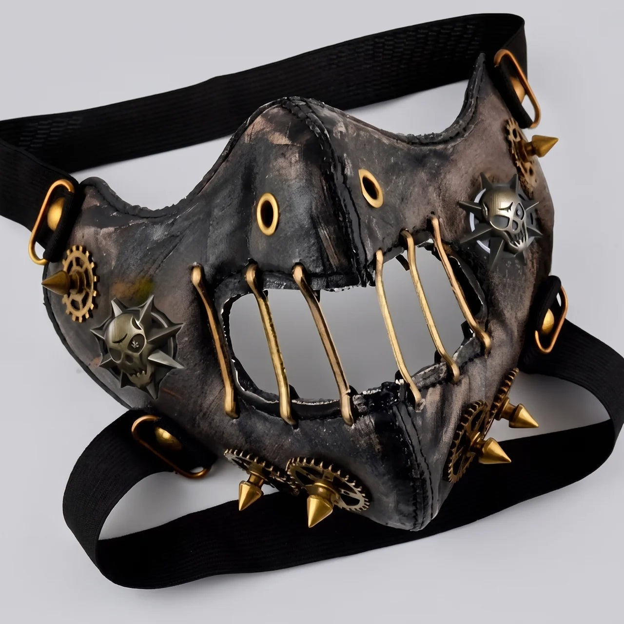 Black and gold steampunk half mask with spikes, gears, and rivets | Chaps London