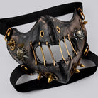 Black and gold steampunk half mask with spikes, gears, and rivets | Chaps London