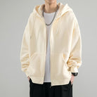 Cream zip-up hoodie worn by man with chain necklace, oversized fit | Chaps London