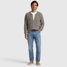 Man wearing grey ribbed zip cardigan with blue jeans and white t-shirt | Chaps London