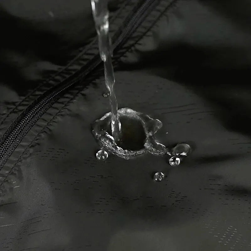 Water droplets beading on black water-repellent fabric near zipper seam | Chaps London