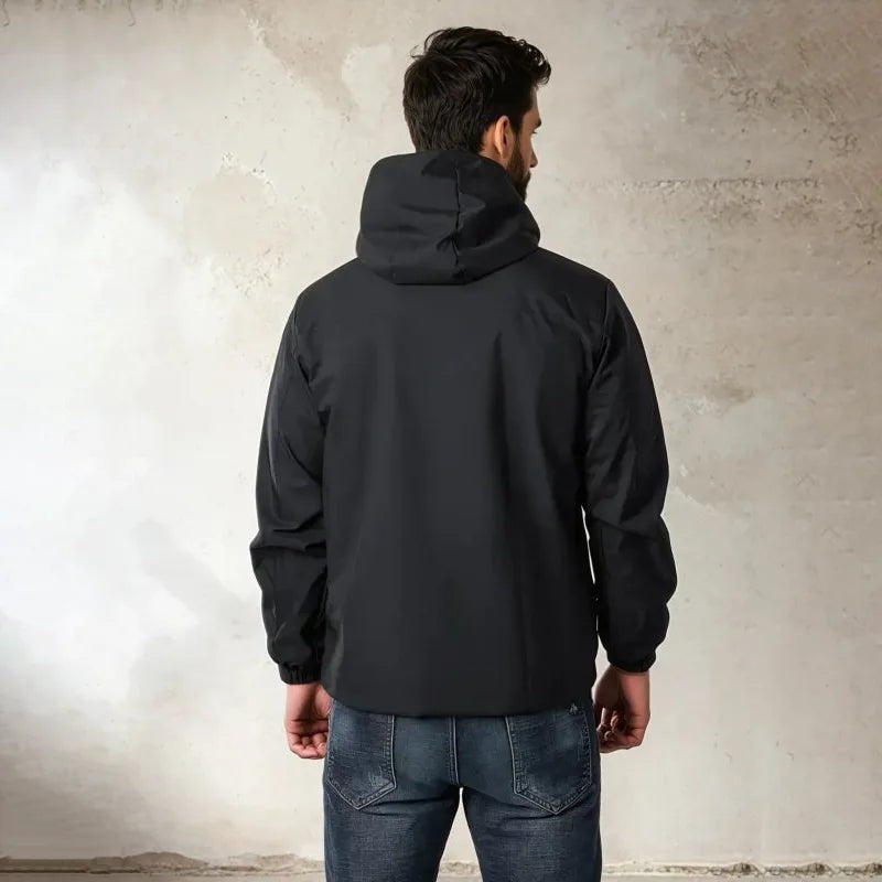 Man wearing black hooded rain jacket with jeans, viewed from behind | Chaps London