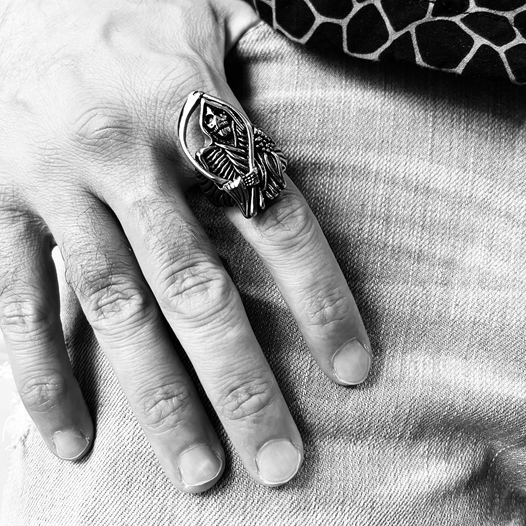 Silver grim reaper ring with scythe design, worn on finger | Chaps London