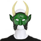 Green half mask with curved horns and beard, worn by a person | Chaps London