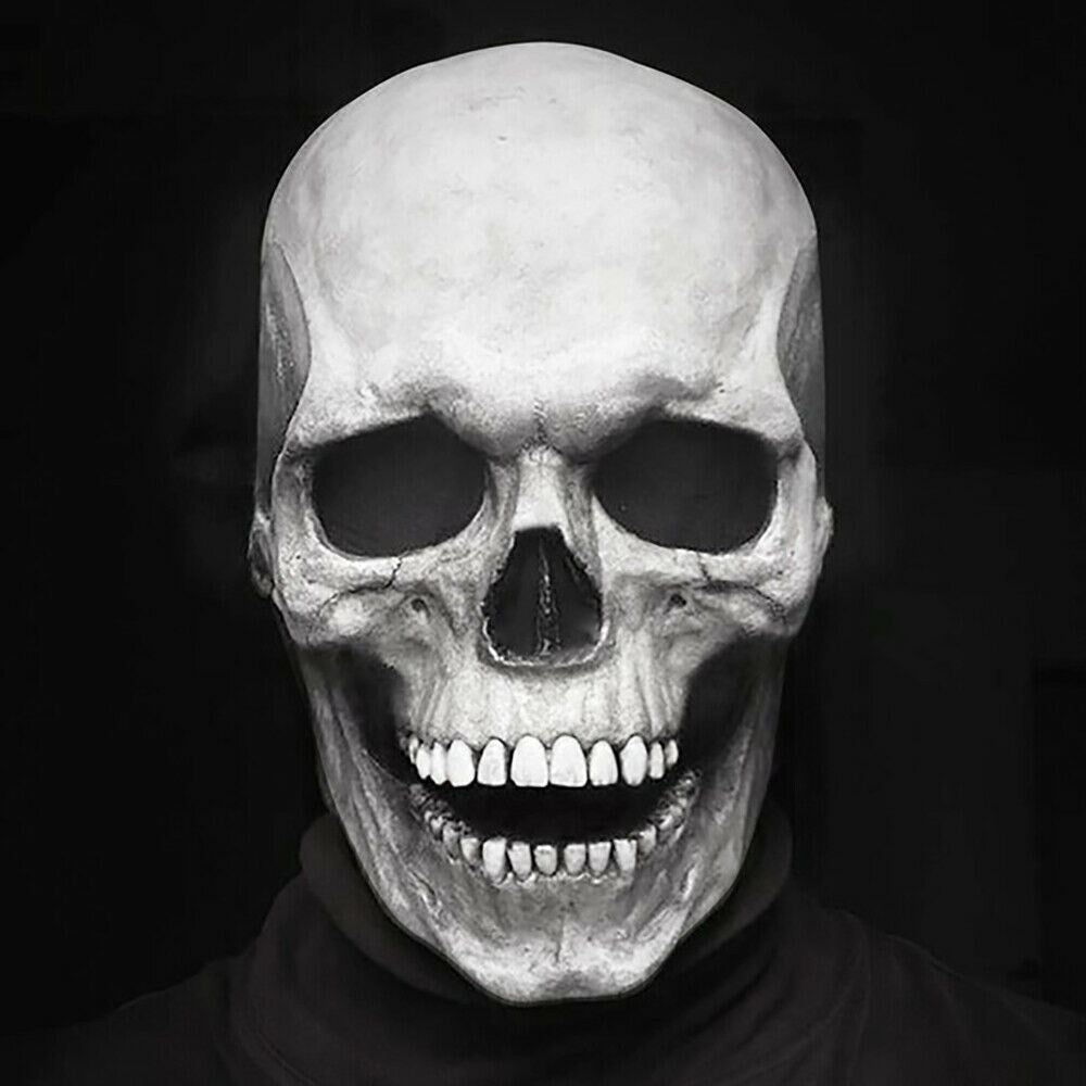 White skull mask with movable jaw worn by person, black background | Chaps London