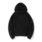 Black knit hoodie with ribbed sleeves, laid flat, hood visible | Chaps London