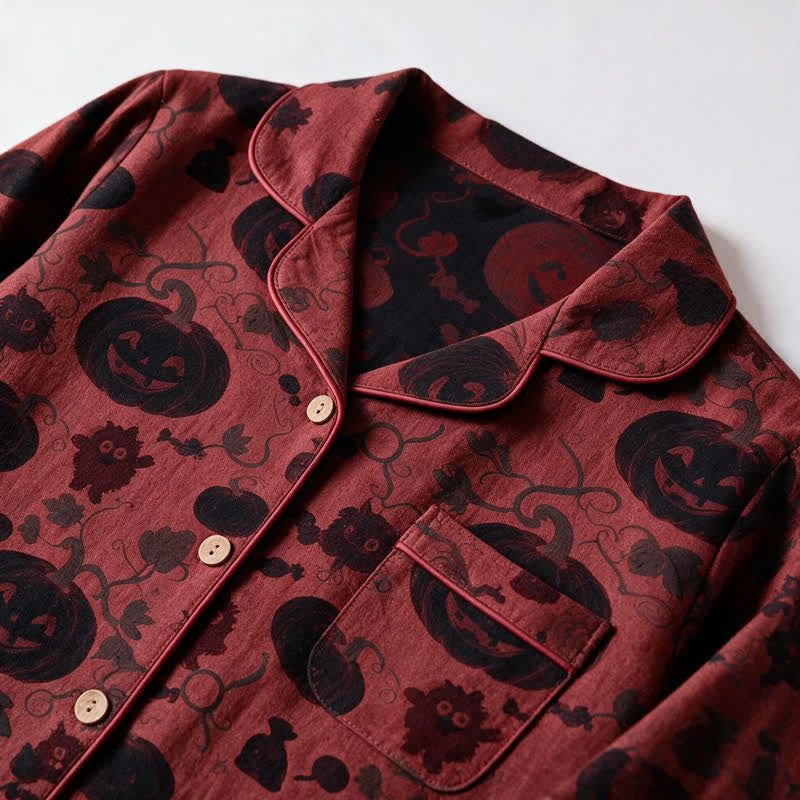 Red pyjama shirt with black pumpkin print, flat lay close-up | Chaps London