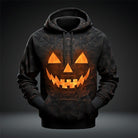 Black hoodie with glowing geometric pumpkin face design, worn by a person | Chaps London