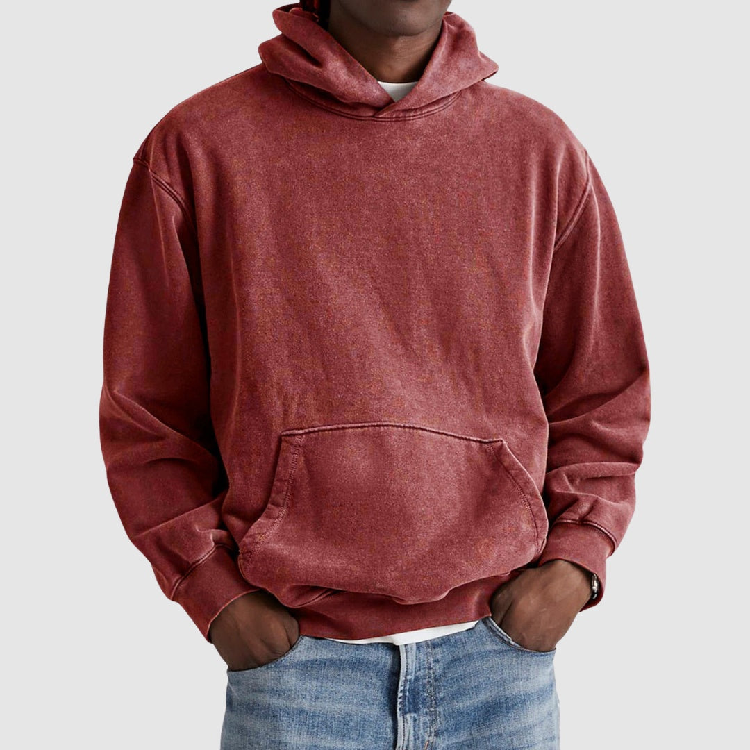 Man wearing washed red hoodie with kangaroo pocket and denim jeans | Chaps London