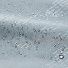 Water droplets beading on gray water-repellent fabric close-up | Chaps London