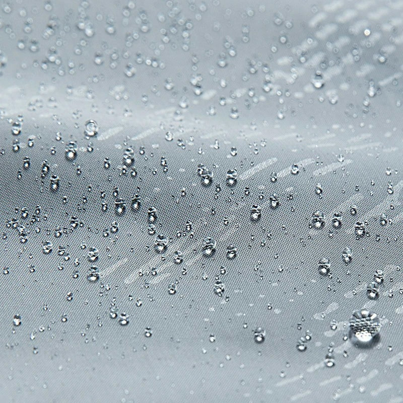 Water droplets beading on gray water-repellent fabric close-up | Chaps London