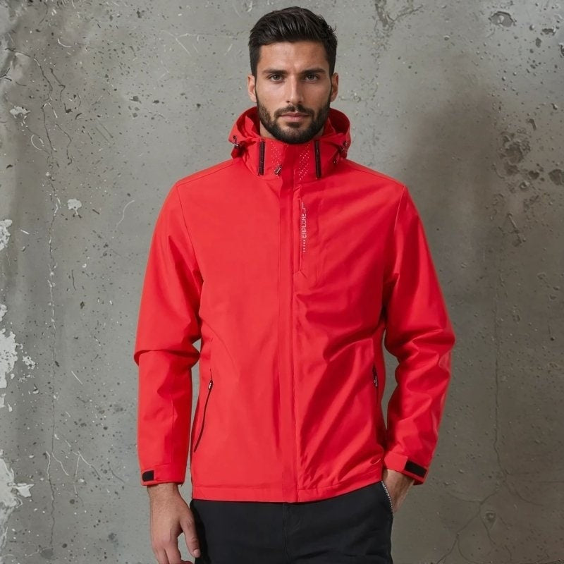 Man wearing red hooded waterproof jacket with zip pockets, standing against concrete wall | Chaps London