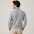 Man wearing grey ribbed turtleneck sweater, back view, with beige trousers | Chaps London