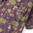 Purple kimono fabric with green pumpkin print and little monster designs, flat view | Chaps London