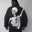 Black puffer jacket worn by man, white skeleton design on back | Chaps London