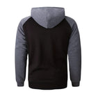 Black hoodie with gray contrast sleeves and hood, worn by person, back view | Chaps London