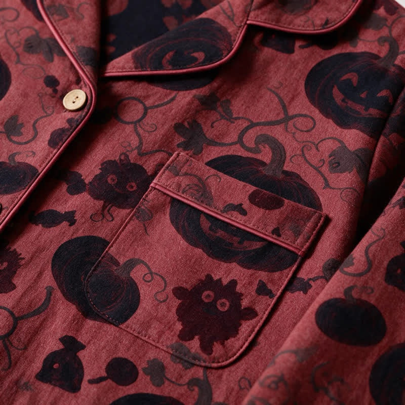 Red and black pyjama shirt with pumpkin print, close-up worn view | Chaps London