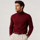 Man wearing burgundy ribbed turtleneck sweater with beige trousers and belt | Chaps London