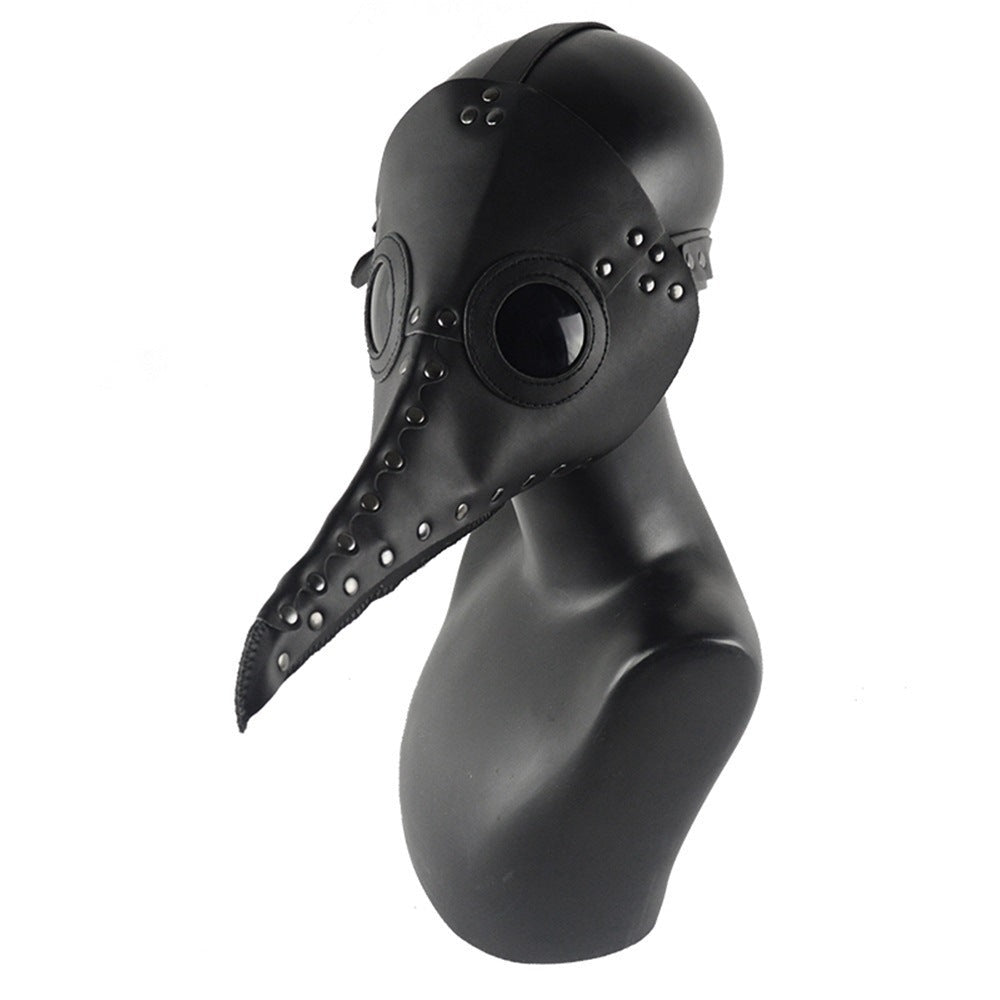 Black plague doctor mask with long beak and rivets on mannequin | Chaps London