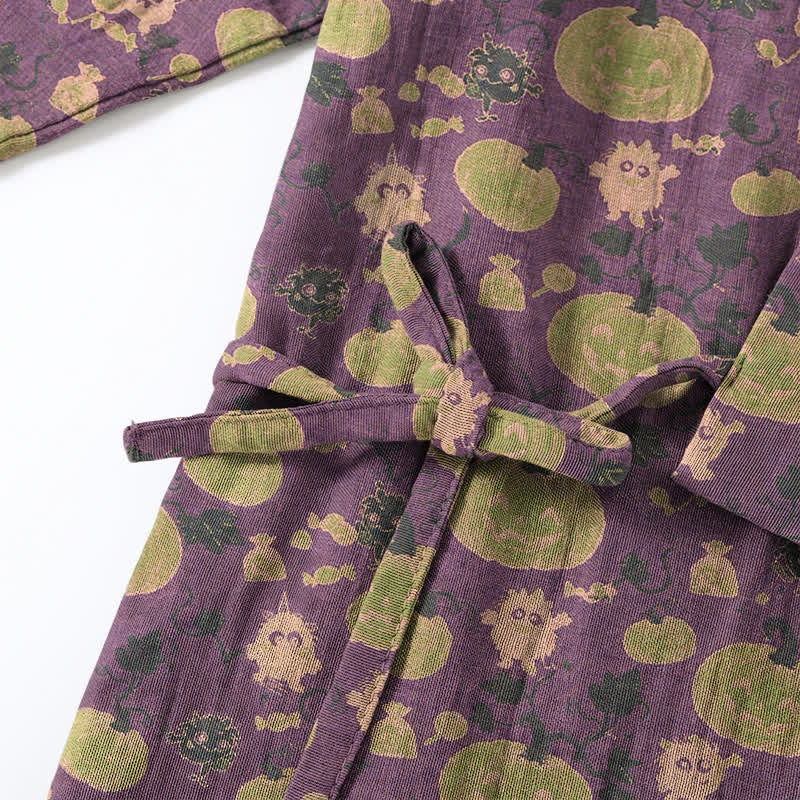 Purple kimono with tied belt, green pumpkin and monster print, flat lay closeup | Chaps London
