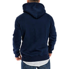 Man wearing navy blue hoodie, back view, layered white hem visible | Chaps London