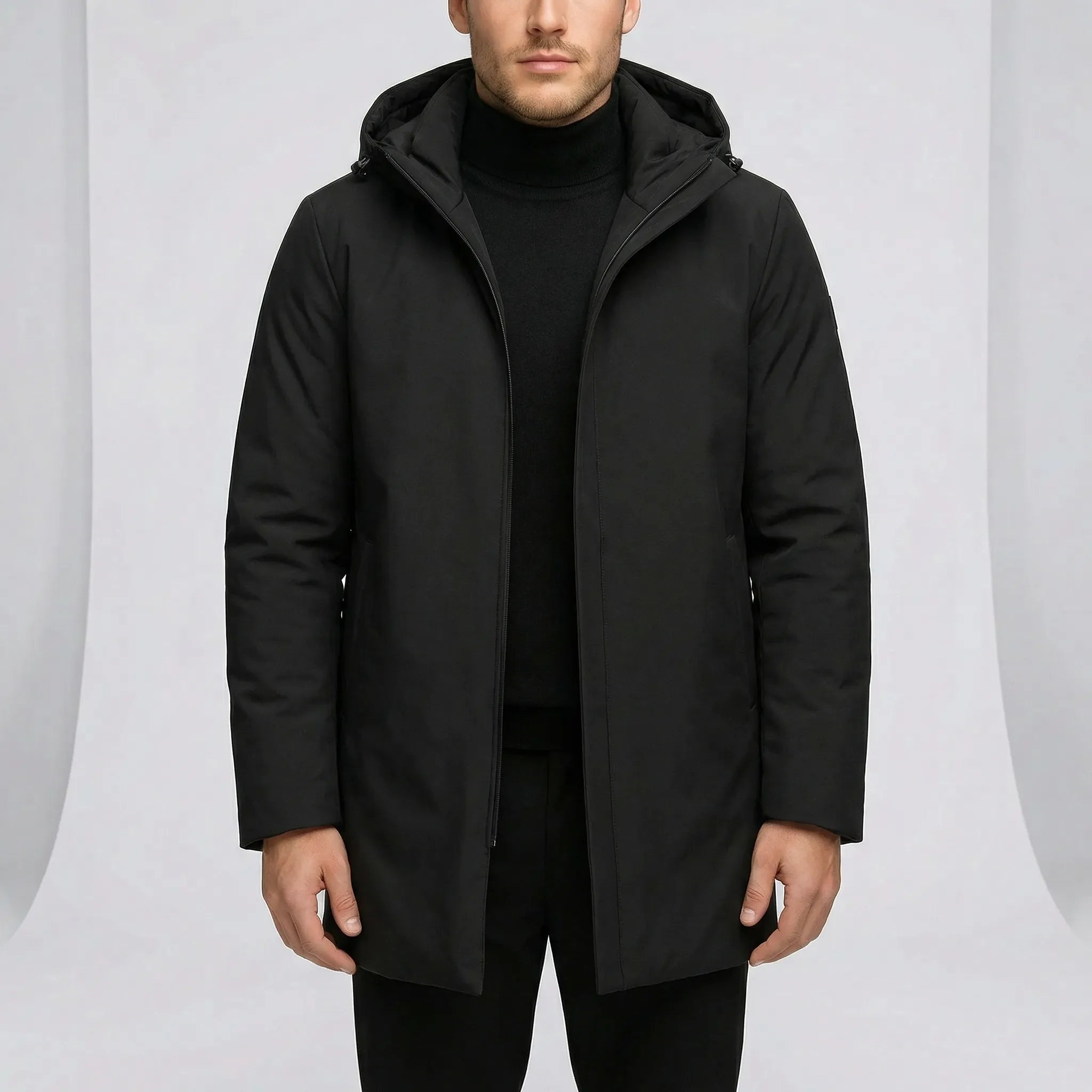 Black hooded coat with concealed zip worn by man, mid length | Chaps London