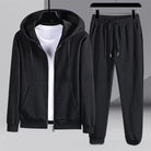 Black waffle-textured zip hoodie and matching jogger pants, flat on hangers | Chaps London