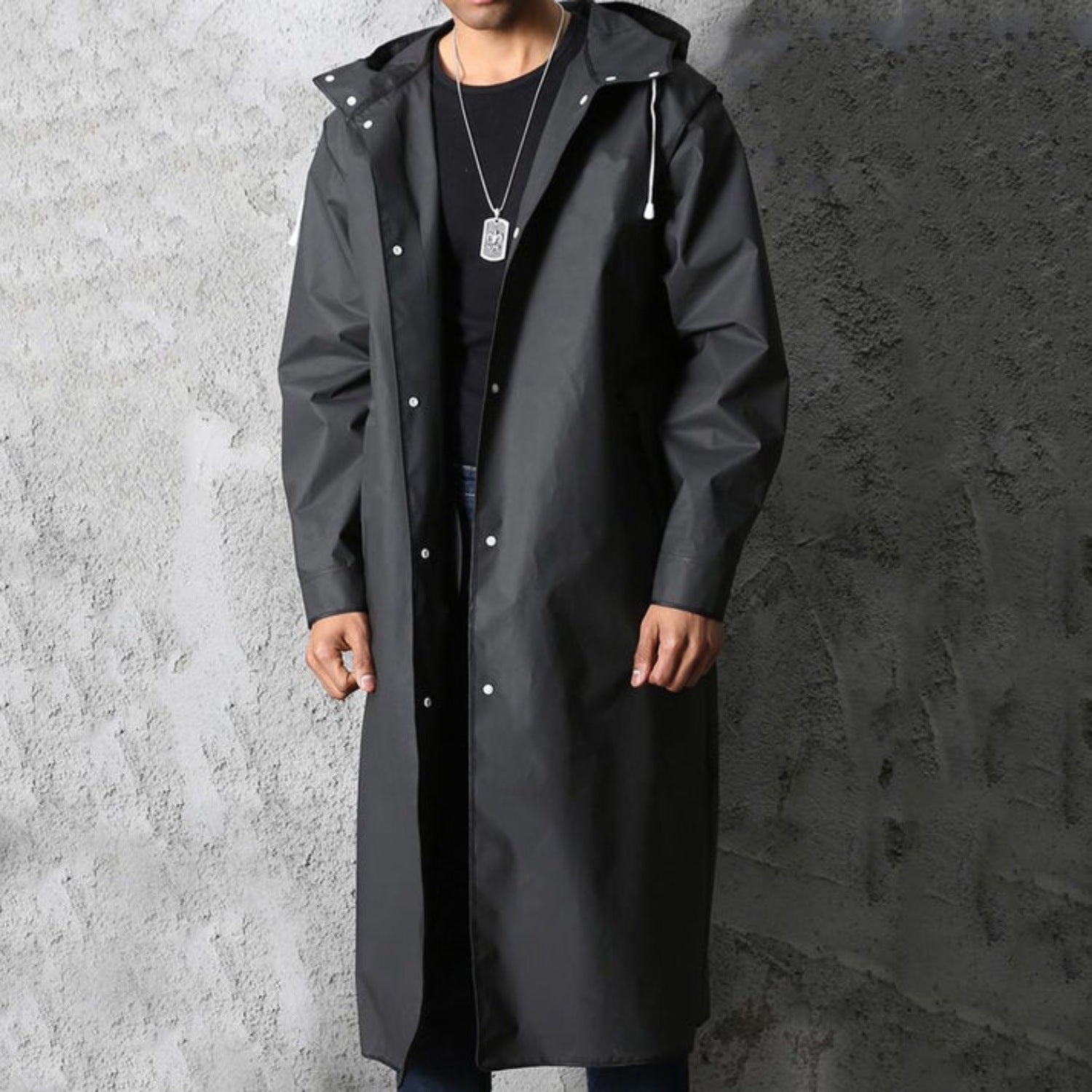 Man wearing long black hooded raincoat with front snap buttons | Chaps London