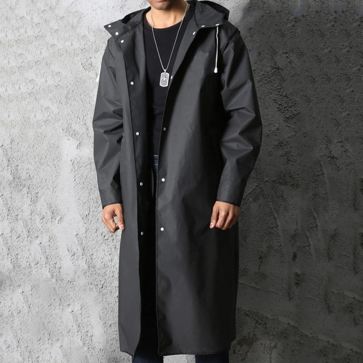 Man wearing long black hooded raincoat with front snap buttons | Chaps London
