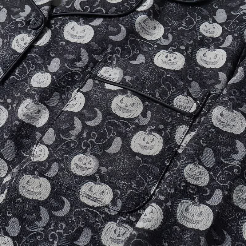 Black pyjama fabric with pumpkin, ghost and bat print, shown flat | Chaps London