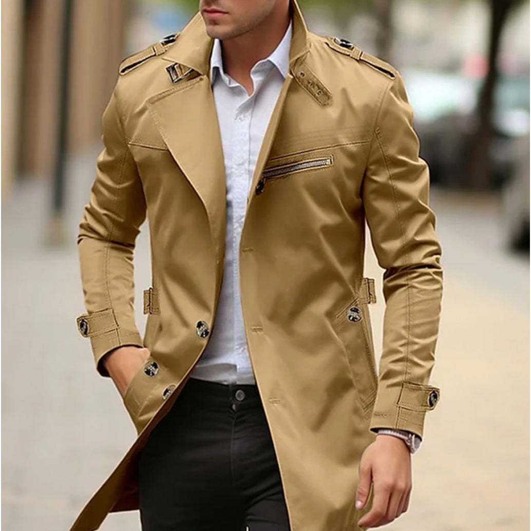 Man wearing khaki trench coat with epaulettes, buttoned front, worn outdoors | Chaps London