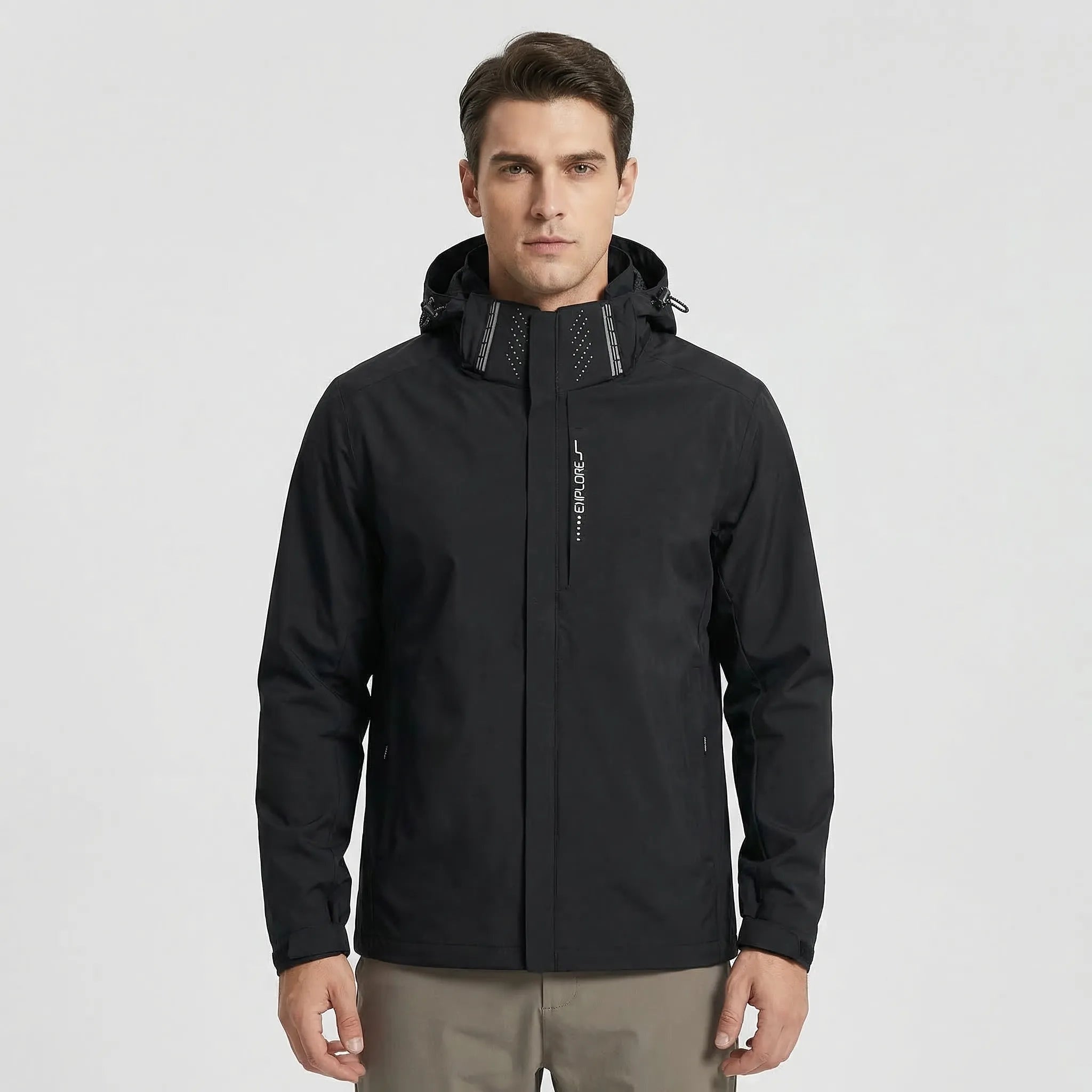 Man wearing black hooded rain jacket with zip pockets, worn standing | Chaps London